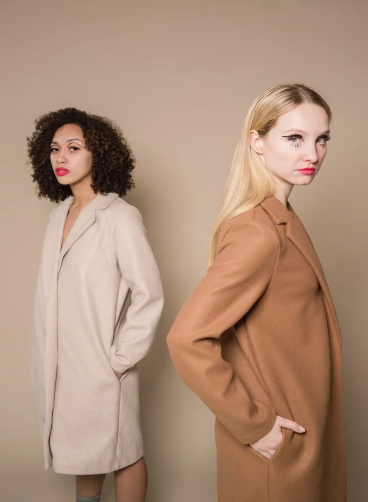 Elegant diverse women in trendy coats