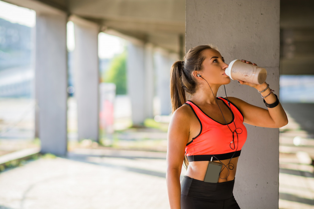 woman drinking protein shake