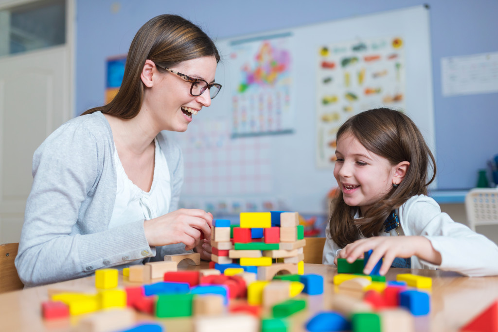 mom and kid playing with toys
