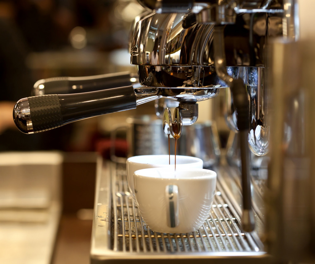 an expresso machine pulling coffee