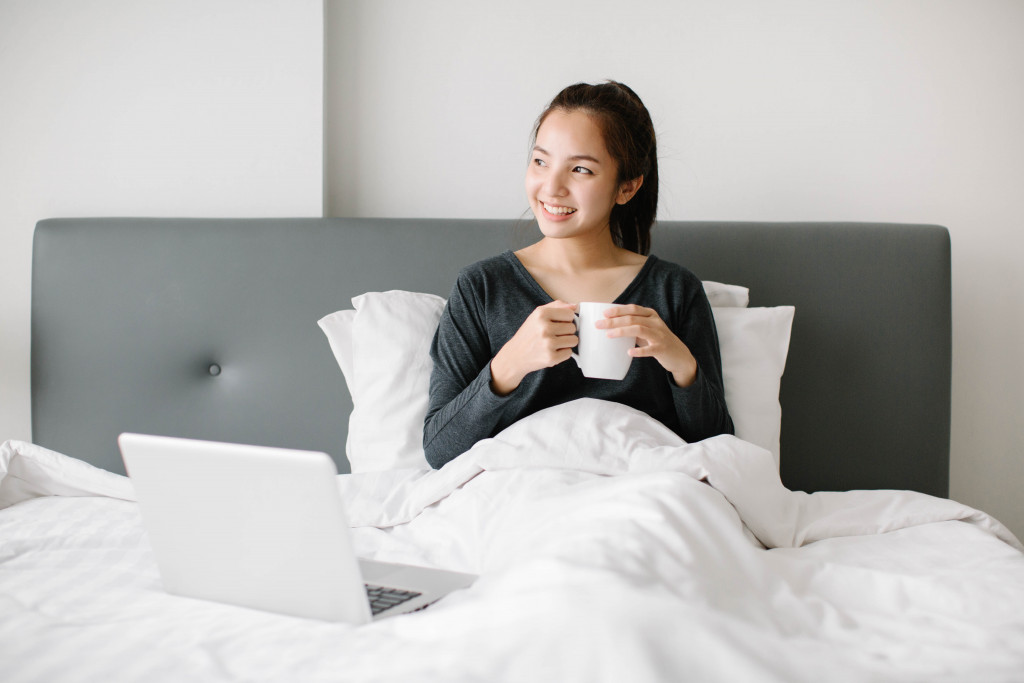 woman drinking tea in the bed