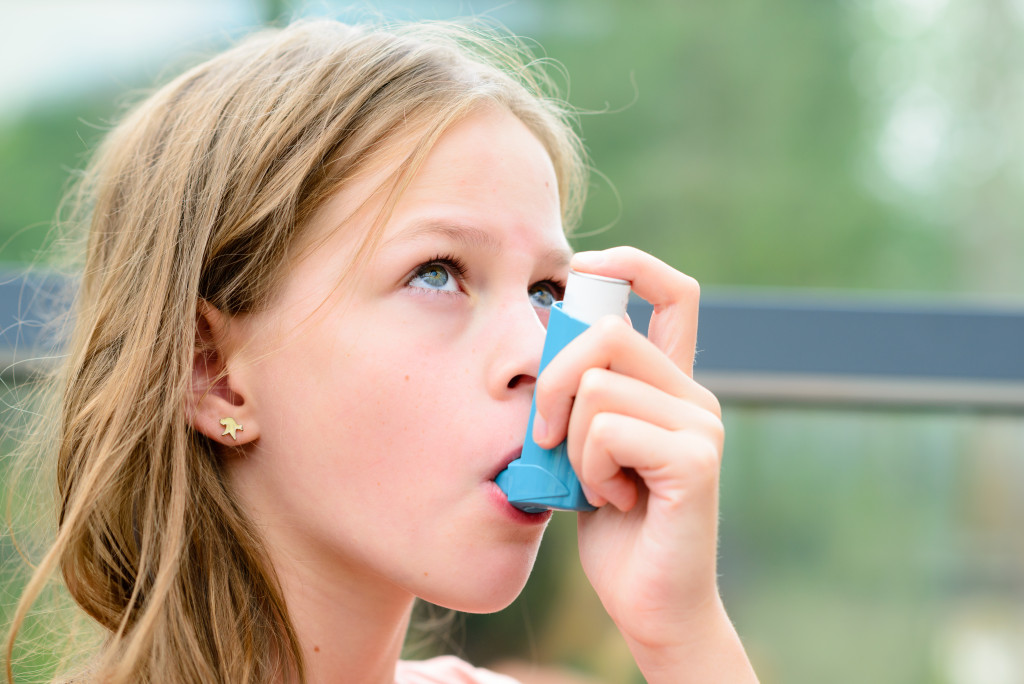 a child taking inhaler
