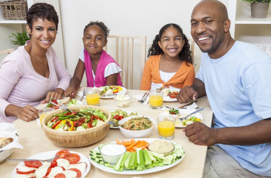 a happy family eating healthy meal