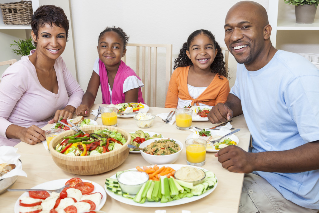 a happy family eating healthy meal