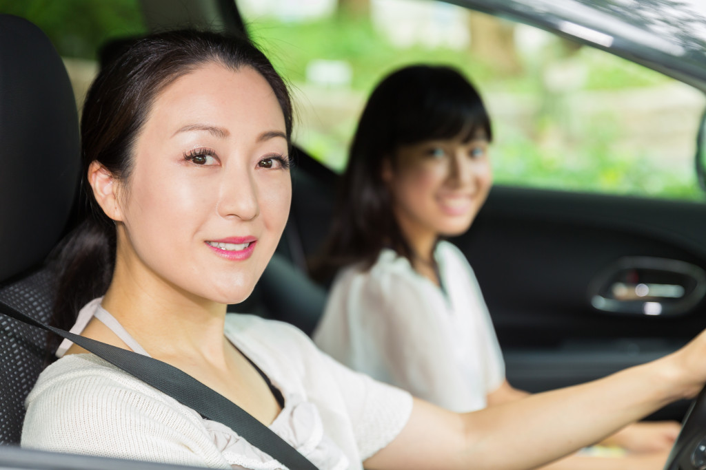 mother driving her daughter