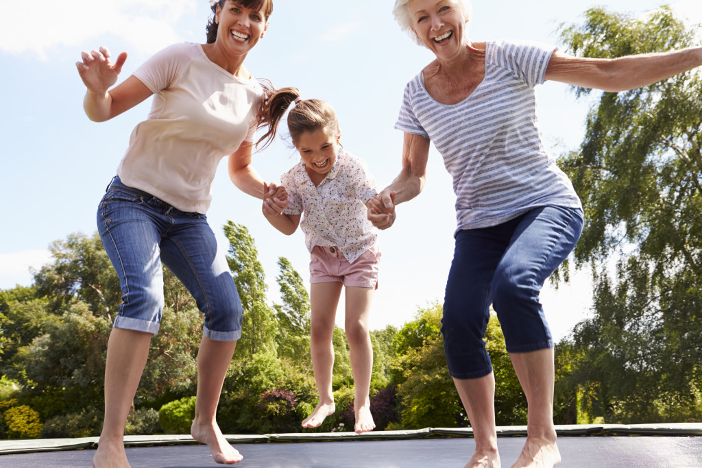 family jumping on a trampoline