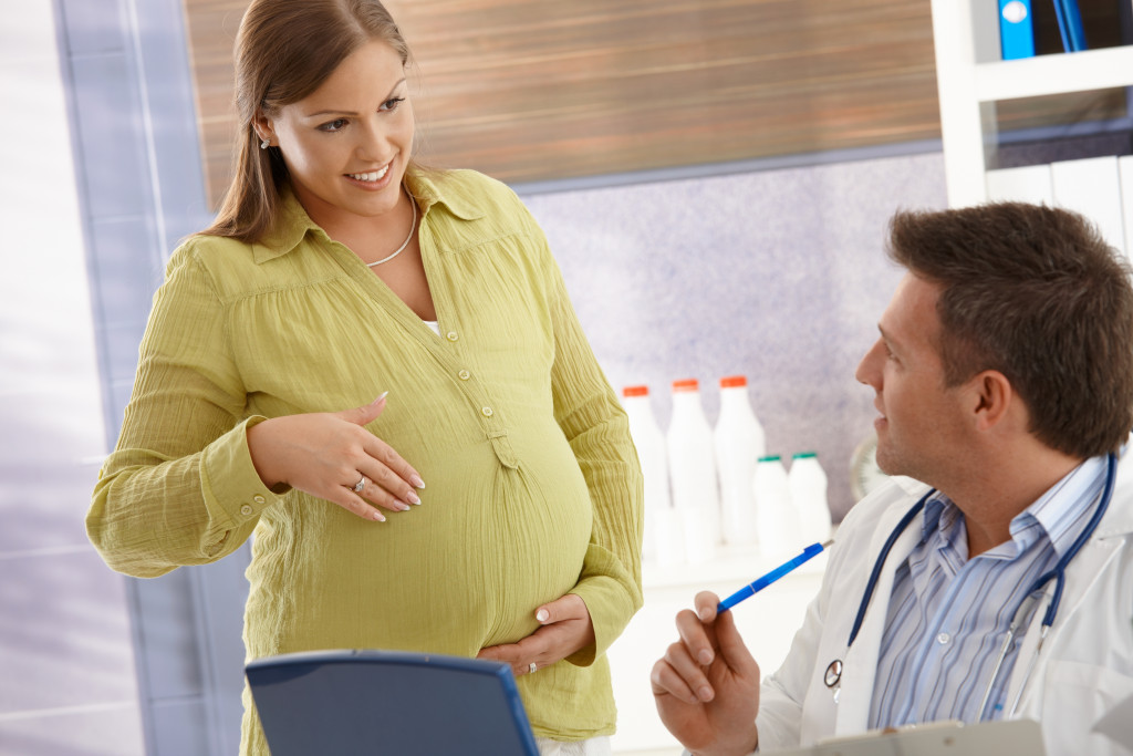 A pregnant woman consulting her doctor.