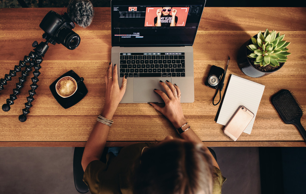 Woman editing video on computer