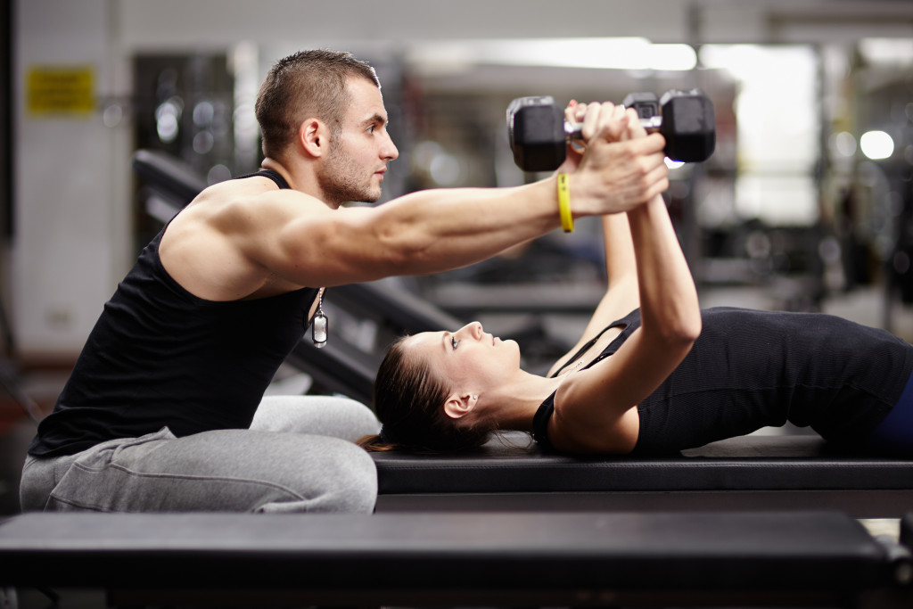 woman working out with her coach