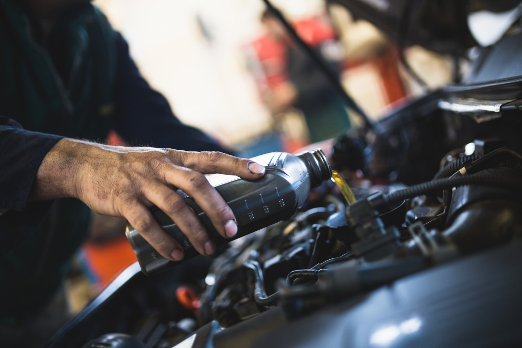 Mechanic doing car service and maintenance