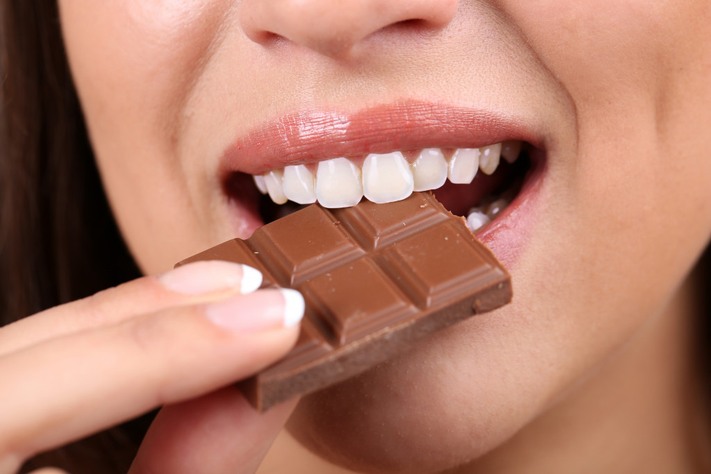 woman eating a chocolate