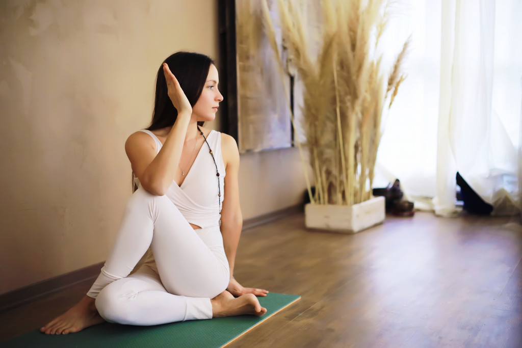 A woman doing yoga exercises at home