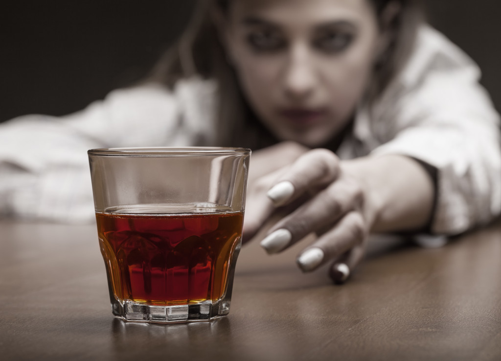 A woman experiencing alcohol addiction
