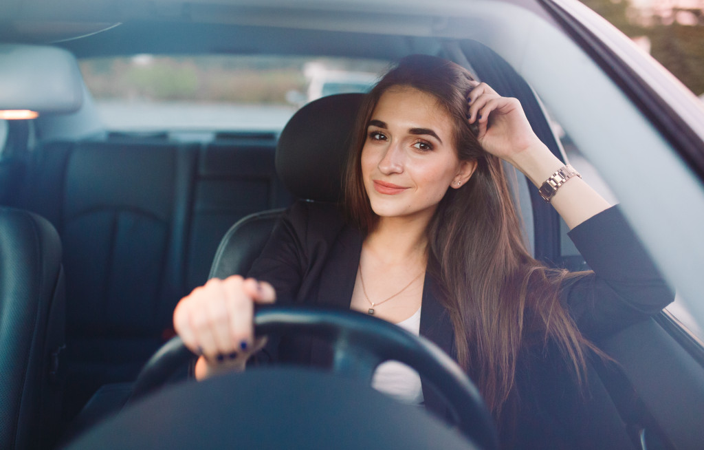 beautiful woman driving a car