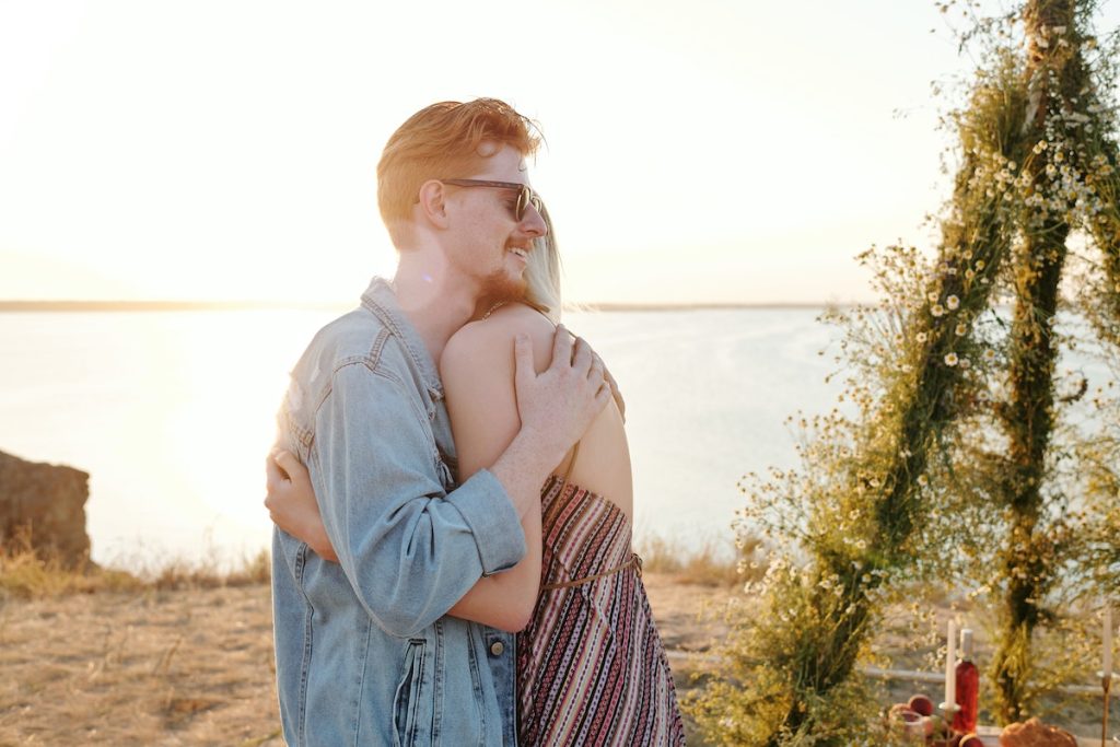 A Couple Hugging on the Beach Shore