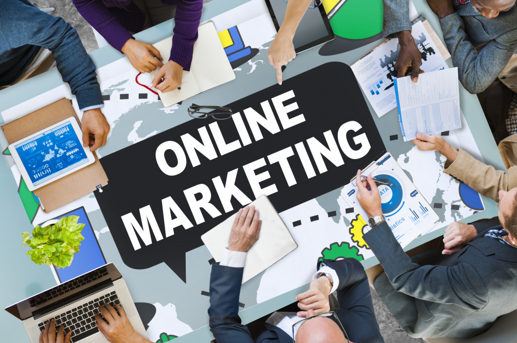 online marketing branding concept surrounded by business workers